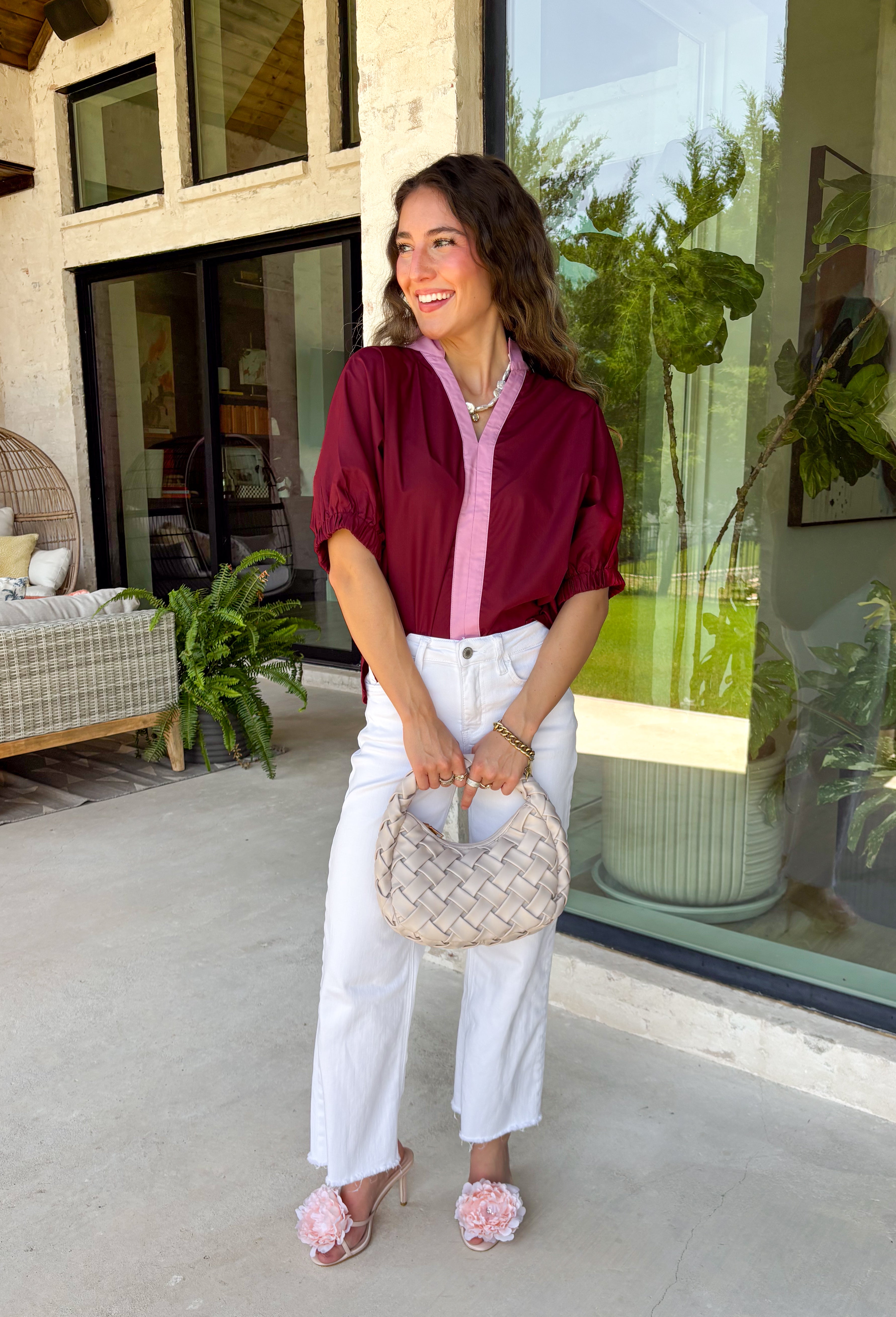 Rich fall colors and timeless details make this burgundy top an instant wardrobe favorite! The deep burgundy hue is beautifully accented with a pink trim along the neckline and front, creating a subtle pop of color that feels both feminine and sophisticated. The elastic puff sleeves add just the right amount of volume, giving this top an elevated look that's perfect for workdays, dinner dates, or weekend outings. Comfortable and easy to style, it's the kind of piece you'll reach for all season long.