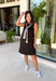 The layered look has never been easier! This black knit mini dress features an attached black and white striped sweater scarf detail, giving you the cozy, elevated style of layered fall fashion in one effortless piece. Crafted from a soft, comfortable knit, it's perfect for crisp autumn days when you want to look polished without sacrificing comfort. From brunch dates and shopping trips to dinner with friends, this chic dress is ready for every fall occasion.