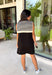 The layered look has never been easier! This black knit mini dress features an attached black and white striped sweater scarf detail, giving you the cozy, elevated style of layered fall fashion in one effortless piece. Crafted from a soft, comfortable knit, it's perfect for crisp autumn days when you want to look polished without sacrificing comfort. From brunch dates and shopping trips to dinner with friends, this chic dress is ready for every fall occasion.