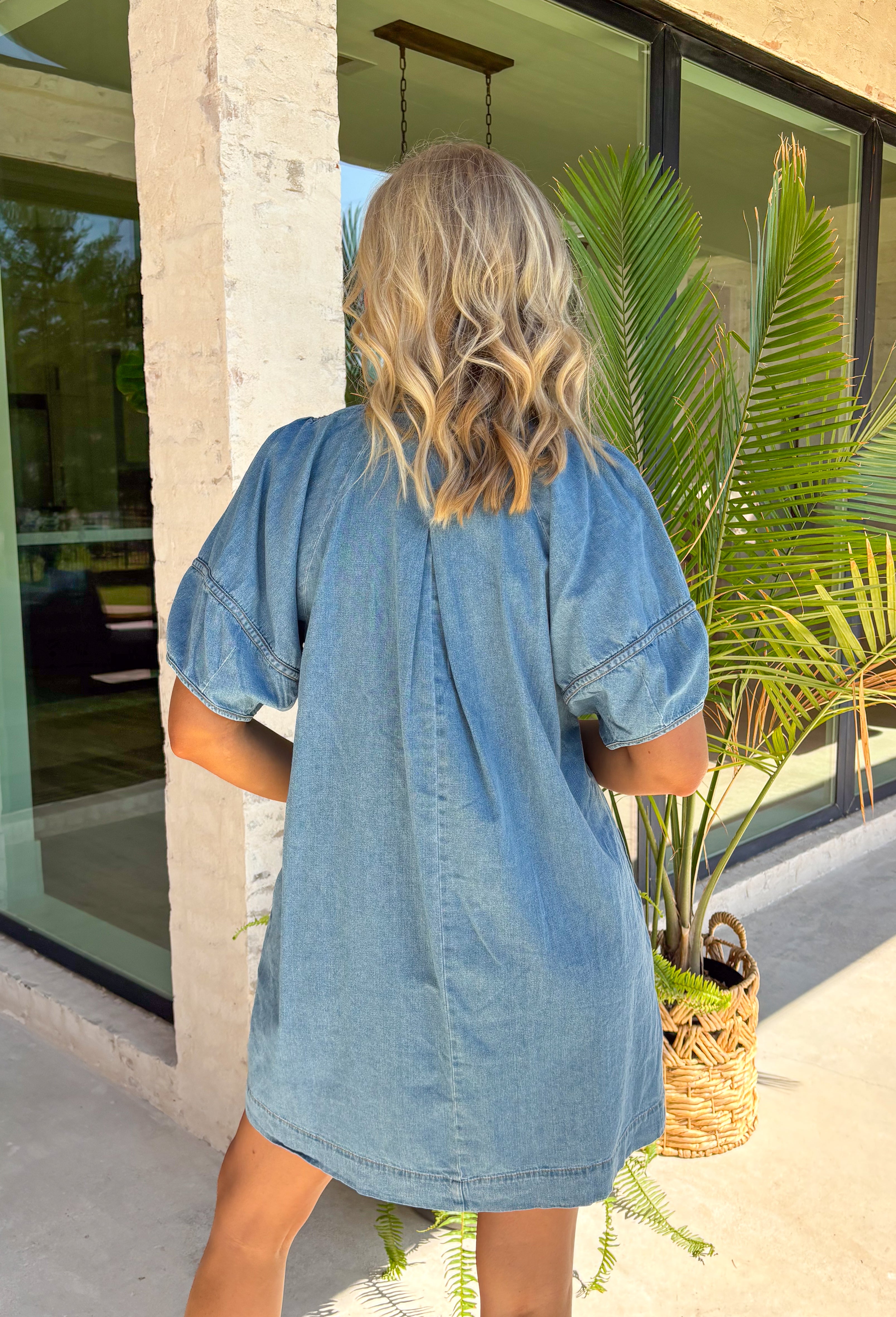 This medium wash denim dress is the kind of effortless staple you’ll reach for all summer long! The tan stitching detail along the front adds just the right amount of contrast, giving it a subtle, elevated touch. Designed with a flattering v-neckline and easy silhouette, it’s both comfortable and polished for everyday wear. And yes—side pockets make it even better! Lightweight with a soft feel, it’s perfect for everything from errands to casual dinners. 
