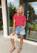 Nothing says “easy spring outfit” like a classic red-and-white stripe moment! This short sleeve top is one of those throw-on-and-go pieces that instantly looks cute without even trying. The bright red base feels fun and fresh for the season, while the crisp white stripes keep it timeless. Finished with elastic sleeve cuffs for a soft, slightly puffed shape, it’s comfy enough for all-day wear and polished enough to dress up with your favorite denim and accessories.