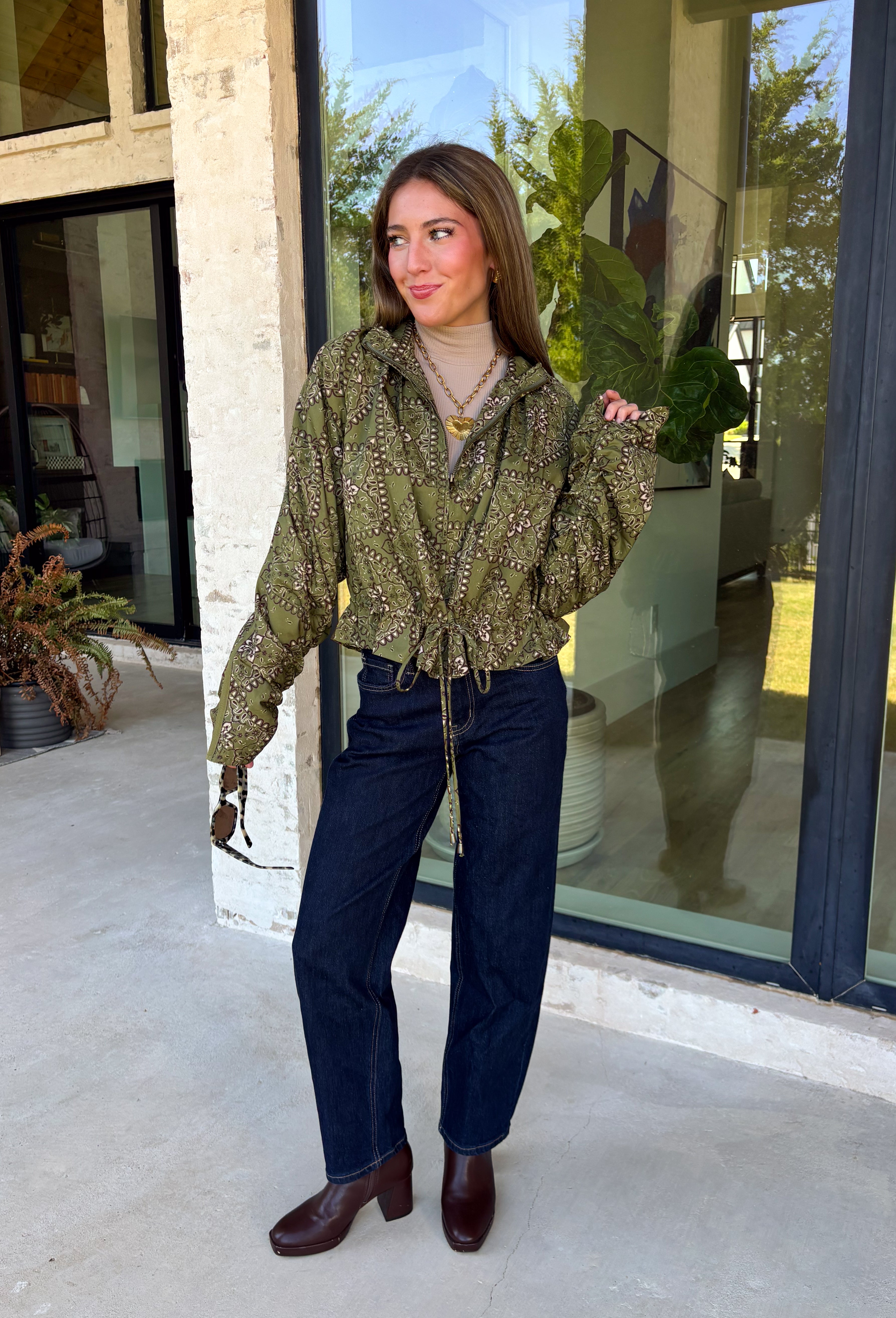 Give your everyday layers a western-inspired twist with this olive bandana jacket from Entro. The rich olive color paired with the bandana-inspired print gives it a vintage feel that's fun without being hard to style. A zipper-front closure keeps the look casual and easy to throw on, while convenient side pockets add an everyday touch you'll appreciate. Made from 100% cotton, it's a great lightweight layer to keep nearby for crisp mornings, weekend errands, and casual nights out. 