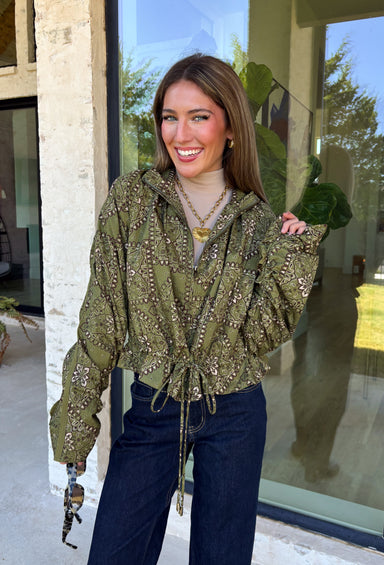 Give your everyday layers a western-inspired twist with this olive bandana jacket from Entro. The rich olive color paired with the bandana-inspired print gives it a vintage feel that's fun without being hard to style. A zipper-front closure keeps the look casual and easy to throw on, while convenient side pockets add an everyday touch you'll appreciate. Made from 100% cotton, it's a great lightweight layer to keep nearby for crisp mornings, weekend errands, and casual nights out. 