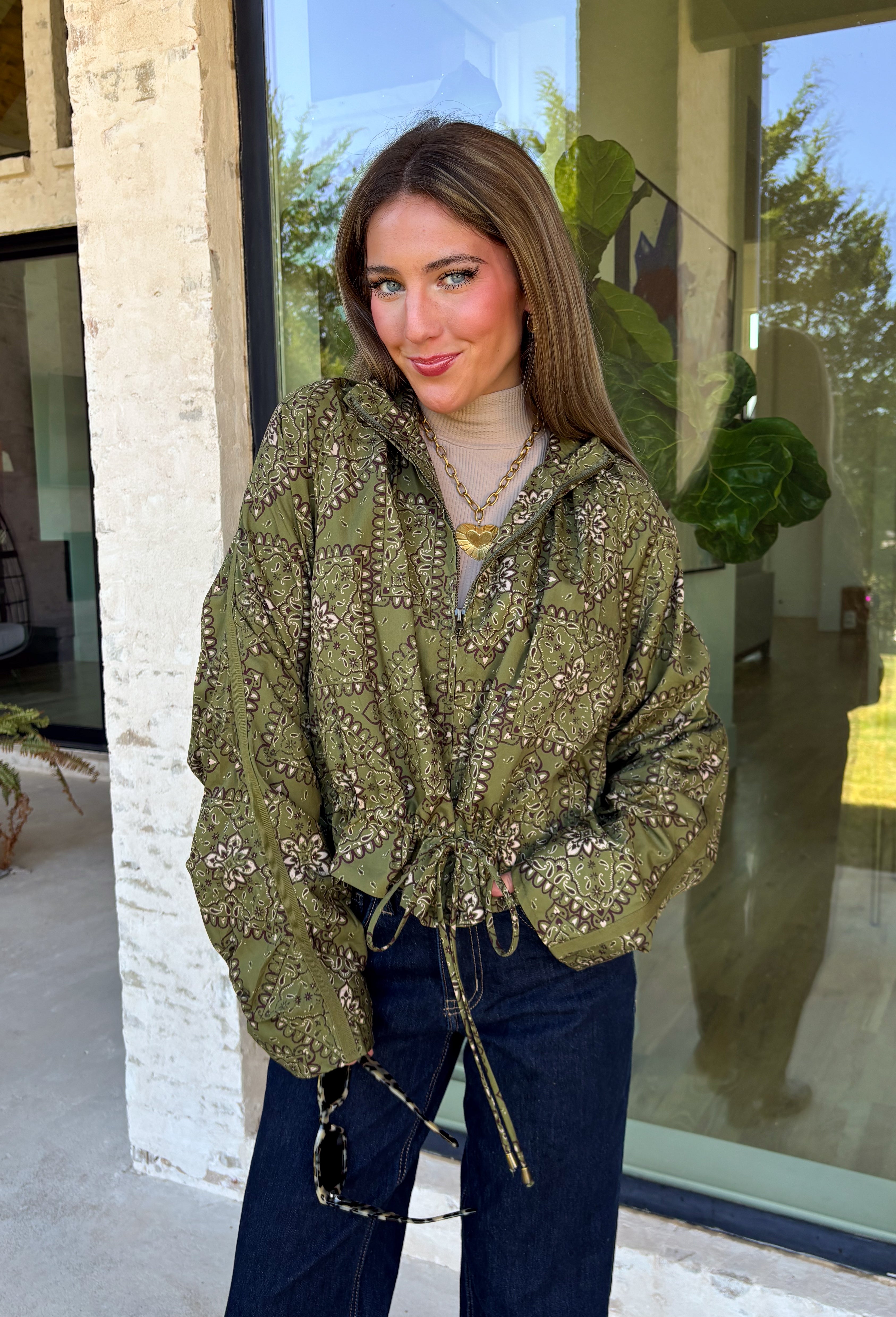Give your everyday layers a western-inspired twist with this olive bandana jacket from Entro. The rich olive color paired with the bandana-inspired print gives it a vintage feel that's fun without being hard to style. A zipper-front closure keeps the look casual and easy to throw on, while convenient side pockets add an everyday touch you'll appreciate. Made from 100% cotton, it's a great lightweight layer to keep nearby for crisp mornings, weekend errands, and casual nights out. 