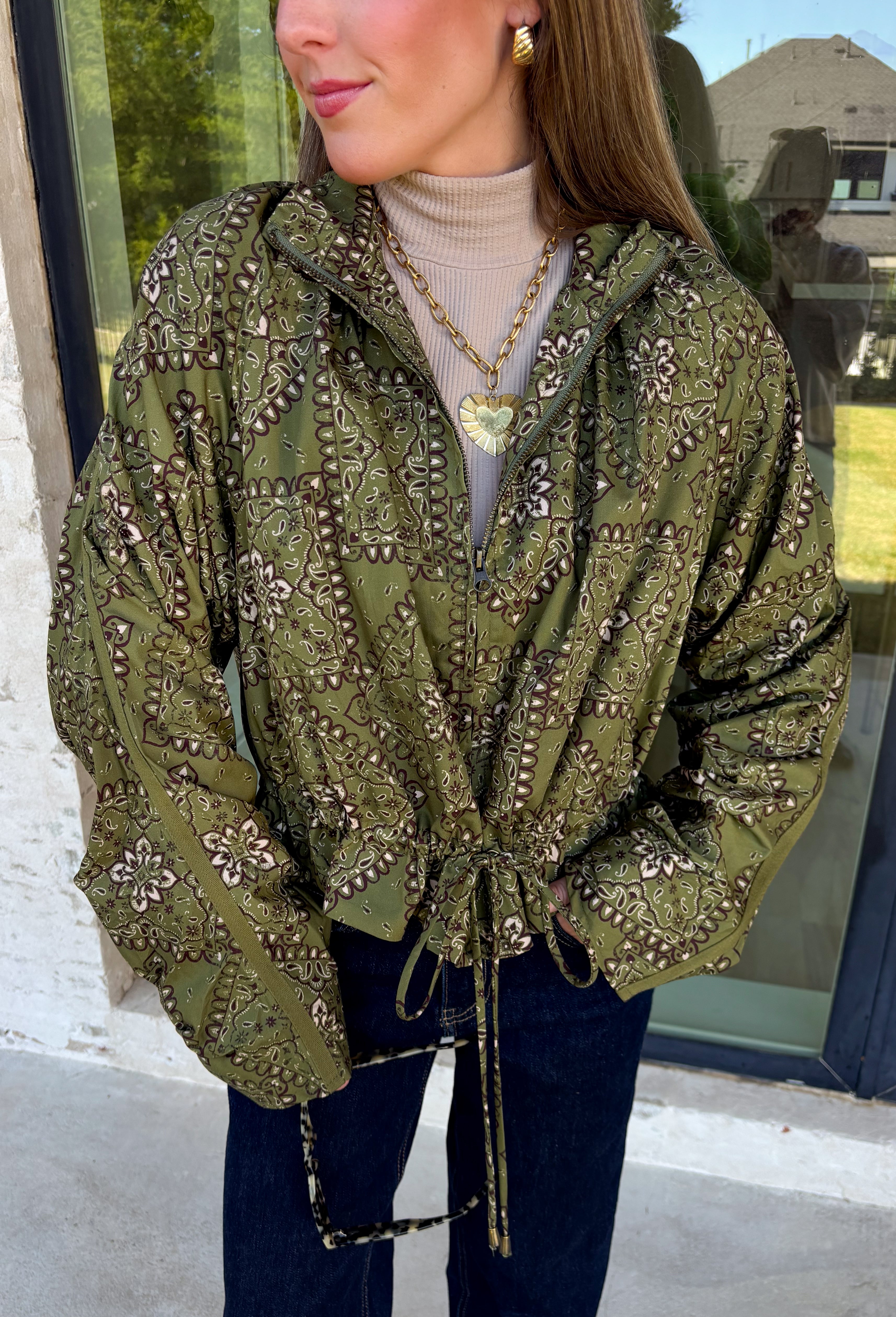 Give your everyday layers a western-inspired twist with this olive bandana jacket from Entro. The rich olive color paired with the bandana-inspired print gives it a vintage feel that's fun without being hard to style. A zipper-front closure keeps the look casual and easy to throw on, while convenient side pockets add an everyday touch you'll appreciate. Made from 100% cotton, it's a great lightweight layer to keep nearby for crisp mornings, weekend errands, and casual nights out. 