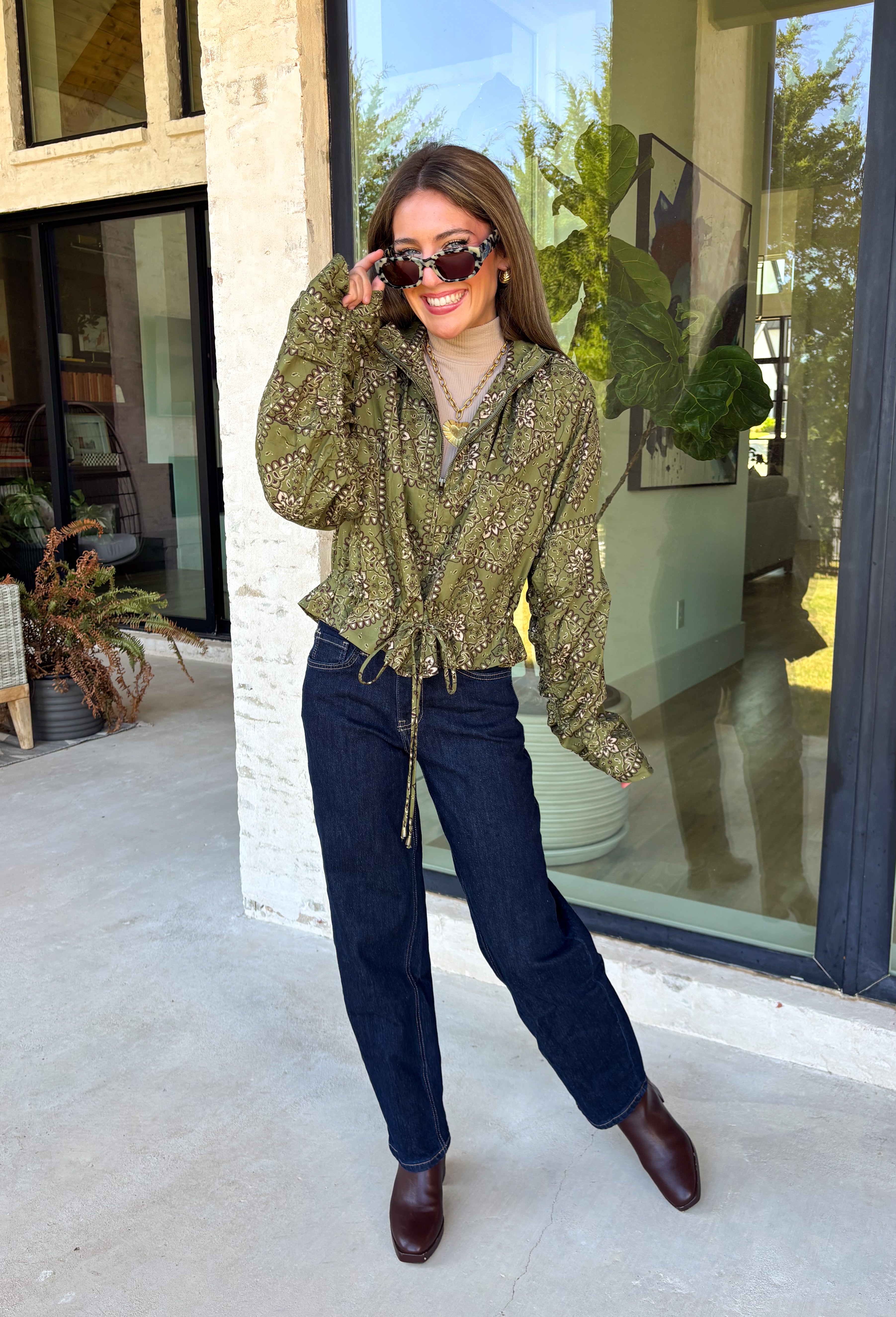 Give your everyday layers a western-inspired twist with this olive bandana jacket from Entro. The rich olive color paired with the bandana-inspired print gives it a vintage feel that's fun without being hard to style. A zipper-front closure keeps the look casual and easy to throw on, while convenient side pockets add an everyday touch you'll appreciate. Made from 100% cotton, it's a great lightweight layer to keep nearby for crisp mornings, weekend errands, and casual nights out. 