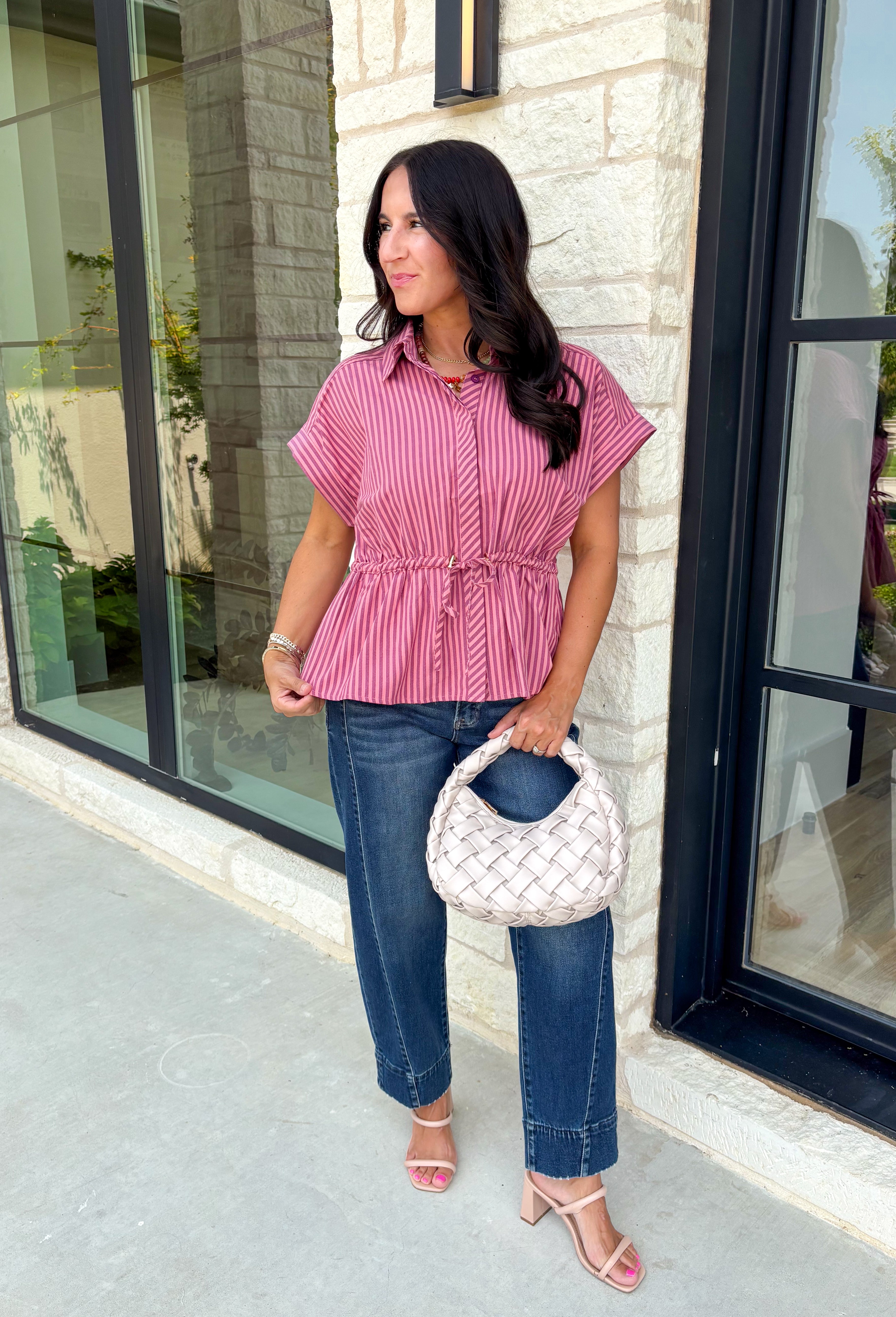 Classic stripes get a flattering update with this effortlessly stylish top that's perfect for the season! Designed in a rich marsala hue with timeless stripe detailing, this lightweight blouse is easy to dress up or down for wherever your day takes you. The adjustable drawstring waist and gathered back create a figure-flattering silhouette, while the button-front design adds a polished finish. 