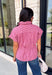 Classic stripes get a flattering update with this effortlessly stylish top that's perfect for the season! Designed in a rich marsala hue with timeless stripe detailing, this lightweight blouse is easy to dress up or down for wherever your day takes you. The adjustable drawstring waist and gathered back create a figure-flattering silhouette, while the button-front design adds a polished finish. 