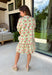 This neutral floral dress is such a fresh and fun pick for summer! With pops of green, pink, red, yellow, and orange, it brings just the right amount of color while still feeling easy to wear for everyday plans. The green and white trim on the sleeves adds a playful contrast, and the subtle ruffle neckline gives it a soft, feminine touch. Lightweight, fully lined, and finished with side pockets (always a win), it’s perfect for everything from brunch to weekend outings. 