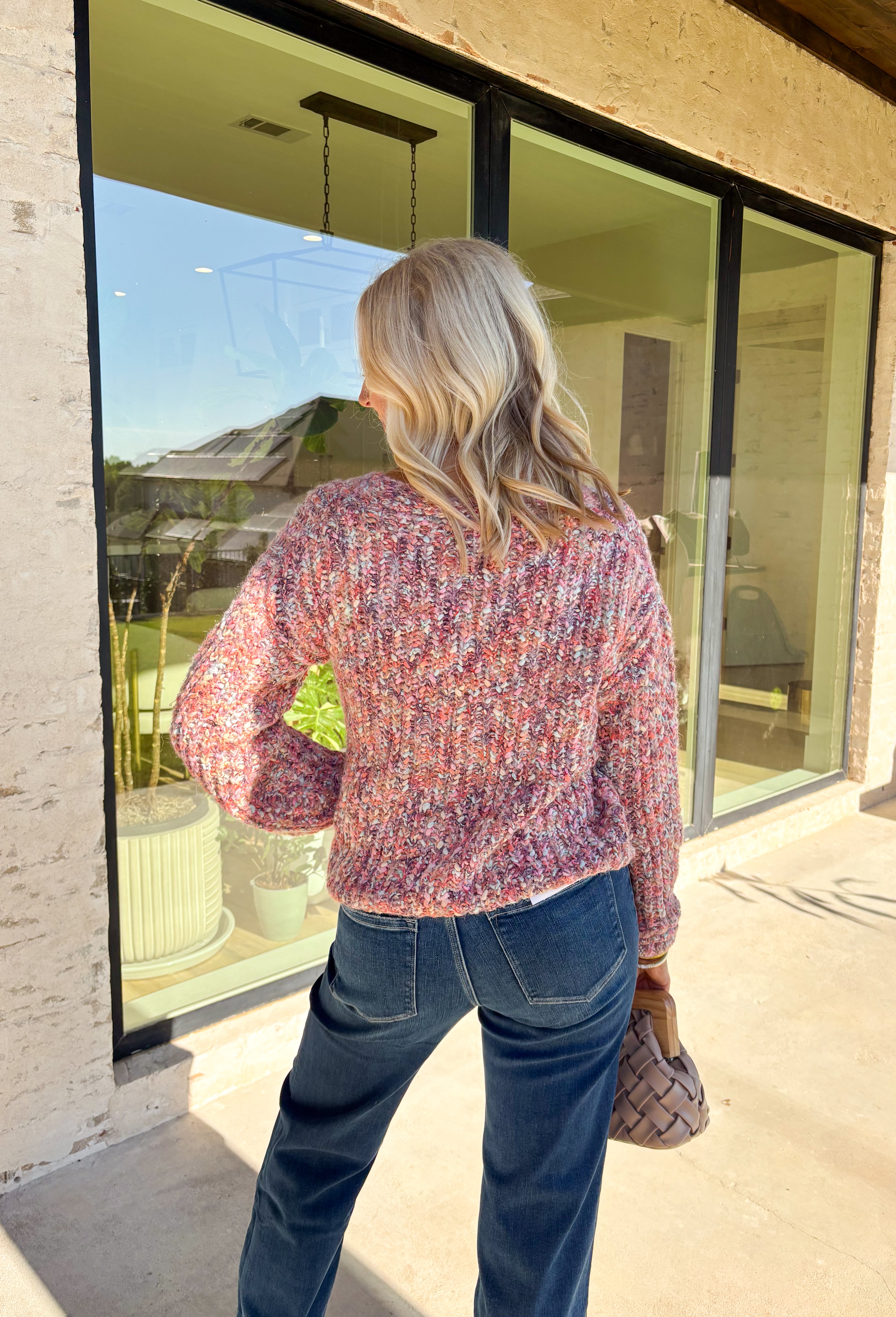 This cozy knit cardigan by Mystree brings warmth and color to your fall wardrobe. Designed in shades of pink, purple, light blue, and cream, it’s finished with a button-down front that makes it easy to style open or closed. Soft with a touch of wool, this piece has that perfect blend of comfort and charm—ideal for layering on crisp days.