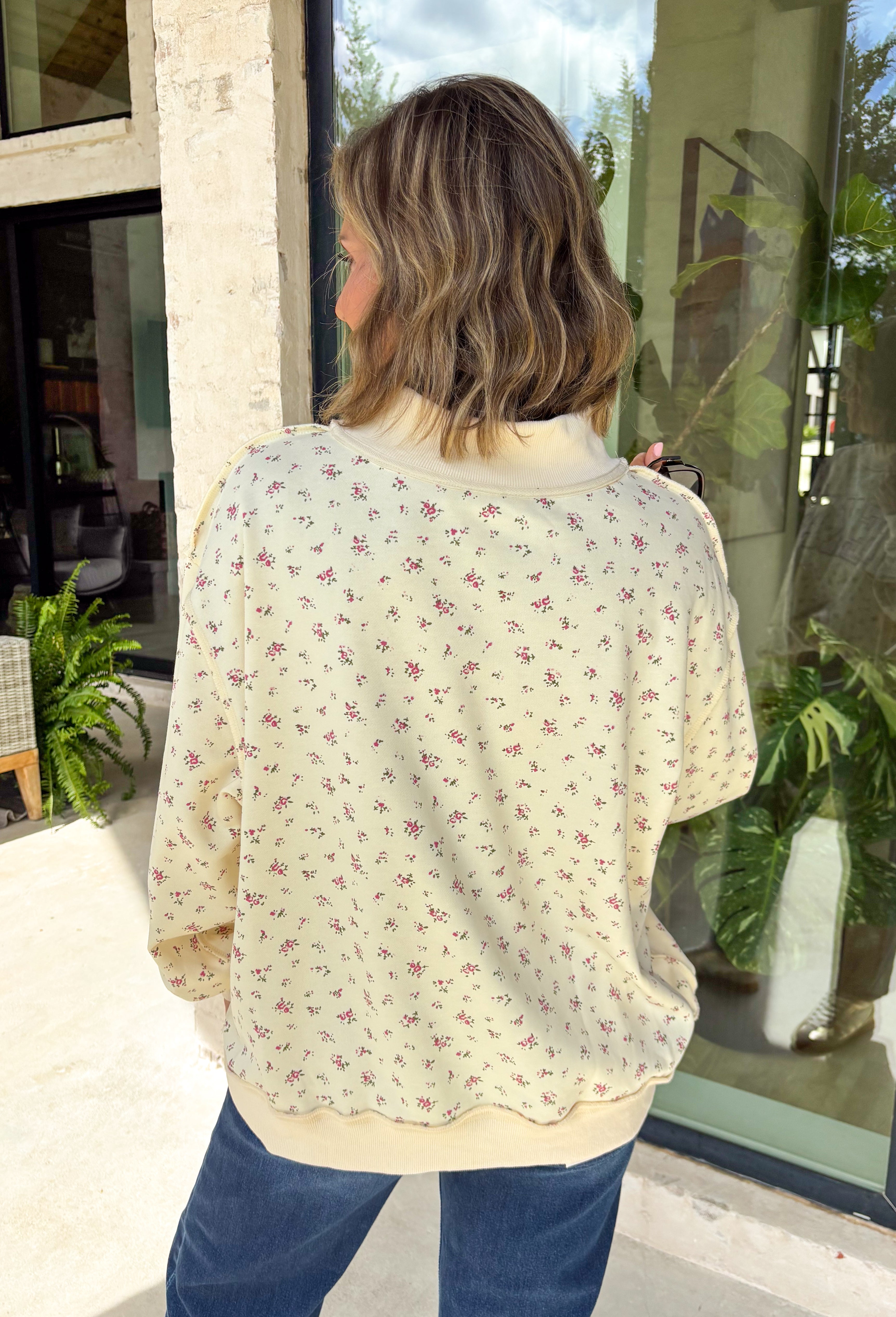 Cute, cozy, and full of Texas charm! This cream mock neck pullover features a dainty pink floral print with “TEXAS” across the front in white outlined in pink for the sweetest statement. It’s the perfect mix of feminine and hometown pride. The soft fabric and relaxed fit make it easy to wear all day, whether you’re running errands, heading to a game, or just keeping things comfy. The mock neck adds a slightly elevated touch while still feeling laid-back and cozy.