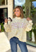 Cute, cozy, and full of Texas charm! This cream mock neck pullover features a dainty pink floral print with “TEXAS” across the front in white outlined in pink for the sweetest statement. It’s the perfect mix of feminine and hometown pride. The soft fabric and relaxed fit make it easy to wear all day, whether you’re running errands, heading to a game, or just keeping things comfy. The mock neck adds a slightly elevated touch while still feeling laid-back and cozy.