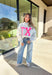 Show your Lone Star pride in this cozy reversible pullover by Bucket List! Crafted from soft fleece, this heather gray mock neck sweatshirt offers two fun looks in one—one side reads “Texas” in bold black lettering, while the reverse features “TX” in bright hot pink. Warm, comfy, and effortlessly cool, it’s perfect for everything from game days to laid-back weekends.