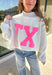 Show your Lone Star pride in this cozy reversible pullover by Bucket List! Crafted from soft fleece, this heather gray mock neck sweatshirt offers two fun looks in one—one side reads “Texas” in bold black lettering, while the reverse features “TX” in bright hot pink. Warm, comfy, and effortlessly cool, it’s perfect for everything from game days to laid-back weekends.