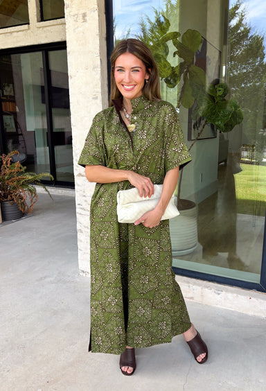 Embrace effortless fall style with this beautifully detailed midi dress from Entro. Designed in a rich olive hue with a vintage-inspired paisley print in shades of brown and off-white, this timeless dress brings the perfect blend of western charm and boho flair. The flattering midi silhouette is easy to dress up or down, while convenient side pockets add an everyday touch you'll love. 