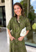 Embrace effortless fall style with this beautifully detailed midi dress from Entro. Designed in a rich olive hue with a vintage-inspired paisley print in shades of brown and off-white, this timeless dress brings the perfect blend of western charm and boho flair. The flattering midi silhouette is easy to dress up or down, while convenient side pockets add an everyday touch you'll love. 
