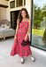 Bring warm seasonal charm to your wardrobe with this beautifully crafted plaid midi dress. Featuring a lovely coral and brown plaid print, this timeless style is designed with a flattering straight neckline and a flowing midi silhouette that's perfect for every fall occasion. Adjustable shoulder straps and a smocked back provide a comfortable, customizable fit, while the fully lined design offers effortless wear from day to night. 