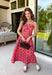 Bring warm seasonal charm to your wardrobe with this beautifully crafted plaid midi dress. Featuring a lovely coral and brown plaid print, this timeless style is designed with a flattering straight neckline and a flowing midi silhouette that's perfect for every fall occasion. Adjustable shoulder straps and a smocked back provide a comfortable, customizable fit, while the fully lined design offers effortless wear from day to night. 