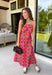 Bring warm seasonal charm to your wardrobe with this beautifully crafted plaid midi dress. Featuring a lovely coral and brown plaid print, this timeless style is designed with a flattering straight neckline and a flowing midi silhouette that's perfect for every fall occasion. Adjustable shoulder straps and a smocked back provide a comfortable, customizable fit, while the fully lined design offers effortless wear from day to night. 