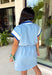 This light blue short sleeve dress is the perfect mix of sporty and cute for summer! Designed with a quarter zip neckline and elastic self-tie waist, it gives you that flattering, adjustable fit while keeping things comfortable for all-day wear. The navy, light blue, and white athletic stripe detail along the front, neckline, and cuffs adds a fun, energetic touch that makes this one stand out. Finished with side pockets (always a win), it’s perfect for everything from errands to casual plans. 