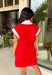 This red short sleeve dress is the perfect mix of sporty and cute for summer! Designed with a quarter zip neckline and elastic self-tie waist, it gives you that flattering, adjustable fit while keeping things comfortable for all-day wear. The red, pink, and white athletic stripe detail along the front, neckline, and cuffs adds a fun, energetic touch that makes this one stand out. Finished with side pockets (always a win), it’s perfect for everything from errands to casual plans.