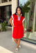 This red short sleeve dress is the perfect mix of sporty and cute for summer! Designed with a quarter zip neckline and elastic self-tie waist, it gives you that flattering, adjustable fit while keeping things comfortable for all-day wear. The red, pink, and white athletic stripe detail along the front, neckline, and cuffs adds a fun, energetic touch that makes this one stand out. Finished with side pockets (always a win), it’s perfect for everything from errands to casual plans.