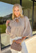 Classic stripes meet timeless style in this beautiful button-down blouse you'll reach for season after season. The soft tan and white striped print, feminine tie neckline, and billowy balloon sleeves create an effortlessly polished look that's perfect for the office, weekend brunch, or your favorite fall outings. Pair it with denim for a casual everyday look or tuck it into tailored trousers for an elevated outfit you'll love wearing all autumn long.