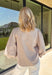 Classic stripes meet timeless style in this beautiful button-down blouse you'll reach for season after season. The soft tan and white striped print, feminine tie neckline, and billowy balloon sleeves create an effortlessly polished look that's perfect for the office, weekend brunch, or your favorite fall outings. Pair it with denim for a casual everyday look or tuck it into tailored trousers for an elevated outfit you'll love wearing all autumn long.