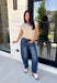 Timeless stripes get a fun seasonal update in this cozy short sleeve sweater. Featuring classic taupe and white stripes with a blue contrast neckline, this knit is the perfect blend of classic and playful. The soft, cozy fabric makes it ideal for crisp fall mornings and cool evenings, while the short sleeves make layering effortless under jackets, and blazers. 