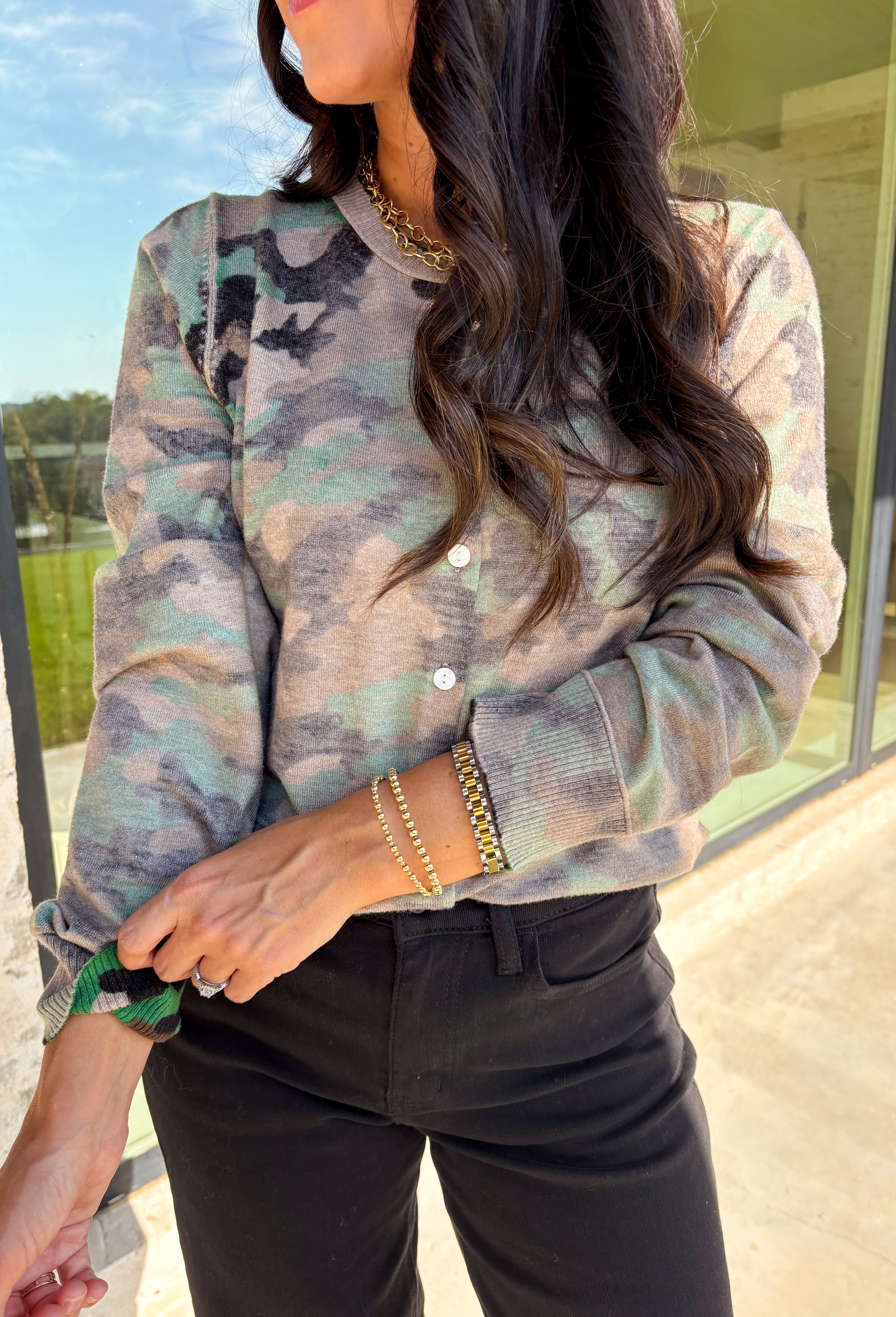 Whether you're sipping cider or lounging fireside, this camo cardigan is ready to bring the cozy vibes. It features a soft knit texture, functional button-down front, and just the right touch of edge thanks to the camo print. It's the kind of layer you’ll want to throw on with leggings, jeans, or even over a graphic tee for a relaxed fall look.