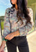 Whether you're sipping cider or lounging fireside, this camo cardigan is ready to bring the cozy vibes. It features a soft knit texture, functional button-down front, and just the right touch of edge thanks to the camo print. It's the kind of layer you’ll want to throw on with leggings, jeans, or even over a graphic tee for a relaxed fall look.