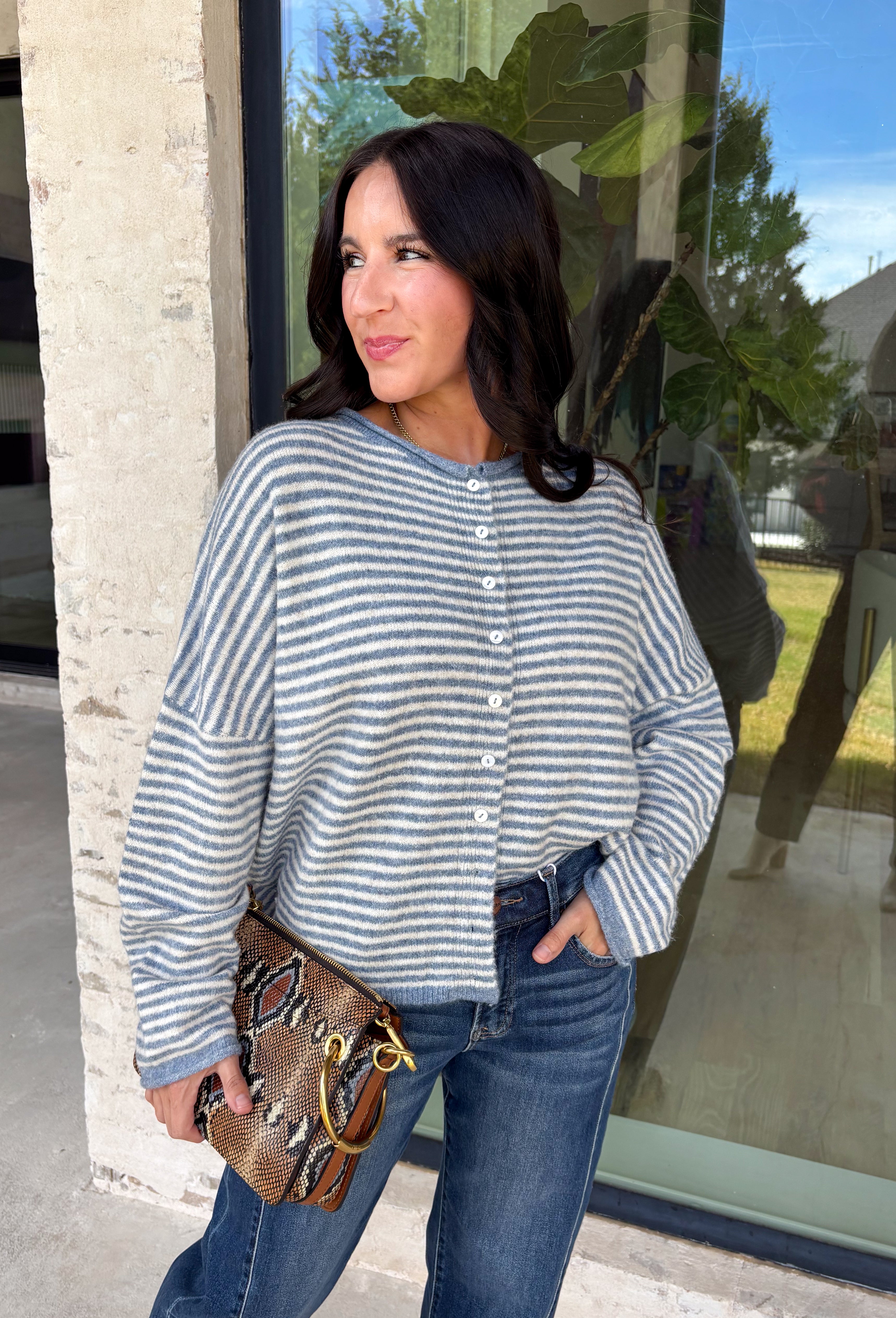 Stay cozy in timeless style with this dusty blue and off white striped cardigan! Made from an ultra-soft knit, this button-down layer is perfect for tossing on over your favorite basics when the temperatures start to cool. Whether you're heading to the office, enjoying a weekend coffee run, or relaxing at home, this cardigan is an effortless staple you'll reach for again and again.