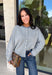 Stay cozy in timeless style with this dusty blue and off white striped cardigan! Made from an ultra-soft knit, this button-down layer is perfect for tossing on over your favorite basics when the temperatures start to cool. Whether you're heading to the office, enjoying a weekend coffee run, or relaxing at home, this cardigan is an effortless staple you'll reach for again and again.