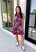 Rich fall colors and beautiful embroidered details make this dress an instant seasonal favorite! Crafted in a gorgeous wine hue, this sleeveless dress features delicate light blue and off white floral embroidery that creates a charming, handcrafted look. The button front and self-tie waist belt with playful contrast pom trim create a flattering silhouette, while side pockets and a fully lined design make it as practical as it is beautiful. 