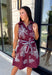Rich fall colors and beautiful embroidered details make this dress an instant seasonal favorite! Crafted in a gorgeous wine hue, this sleeveless dress features delicate light blue and off white floral embroidery that creates a charming, handcrafted look. The button front and self-tie waist belt with playful contrast pom trim create a flattering silhouette, while side pockets and a fully lined design make it as practical as it is beautiful. 