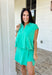 This shamrock green two piece set is the sporty-chic moment your summer wardrobe needs! Designed for days on the go, this athleisure set blends comfort and style in the cutest way. The short sleeve top features a collared neckline with white scalloped embroidered trim and a quarter zip for that polished, elevated feel, while the elastic hem keeps it flattering and easy. The matching skort adds a playful touch with coordinating scalloped trim and built-in comfort for all-day wear. 