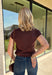 Add a fresh take on classic fall plaid to your wardrobe with this brown micro plaid top from Current Air. The draped cowl neckline creates a soft gathered effect that gives the silhouette a little extra interest without feeling overdone. A ribbed backing adds an unexpected mix of texture, while the warm brown plaid makes it easy to pair with all your favorite autumn neutrals. Wear it with trousers for a put-together office look, then swap in denim and boots when the weekend rolls around.