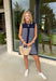 Polished with a playful twist! This navy sleeveless dress features a timeless white stripe print and a unique knit scarf tie detail at the neckline that instantly elevates the look. It’s classic, but with just enough personality to stand out. The sleeveless silhouette keeps it sleek and versatile, while the soft knit fabric offers a comfortable, flattering drape. Whether you’re heading to brunch, the office, or a weekend getaway, this dress makes getting dressed feel effortless and put-together.