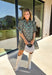 Embrace the beauty of the season in this charming dress from Entro. Featuring a gorgeous floral print in shades of hunter green, muted green, peach, and brown, this feminine dress is perfect for everything from weekend brunches to seasonal celebrations. The button-front design and flattering neckline create a timeless silhouette, while the ¾ puff sleeves with delicate tie details add a playful touch. 