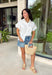 This white ruffle sleeve top is such an effortlessly polished piece for summer! The pearl trim detail adds the prettiest, elevated touch, while the ruffle sleeves bring in a soft, feminine feel. Designed with a classic collared neckline and button front, it’s the perfect mix of timeless and fresh. Lightweight with a hint of stretch, it’s comfortable enough for all-day wear while still looking put together. Whether you're heading to work, brunch, or a casual dinner, this top makes styling so easy. 