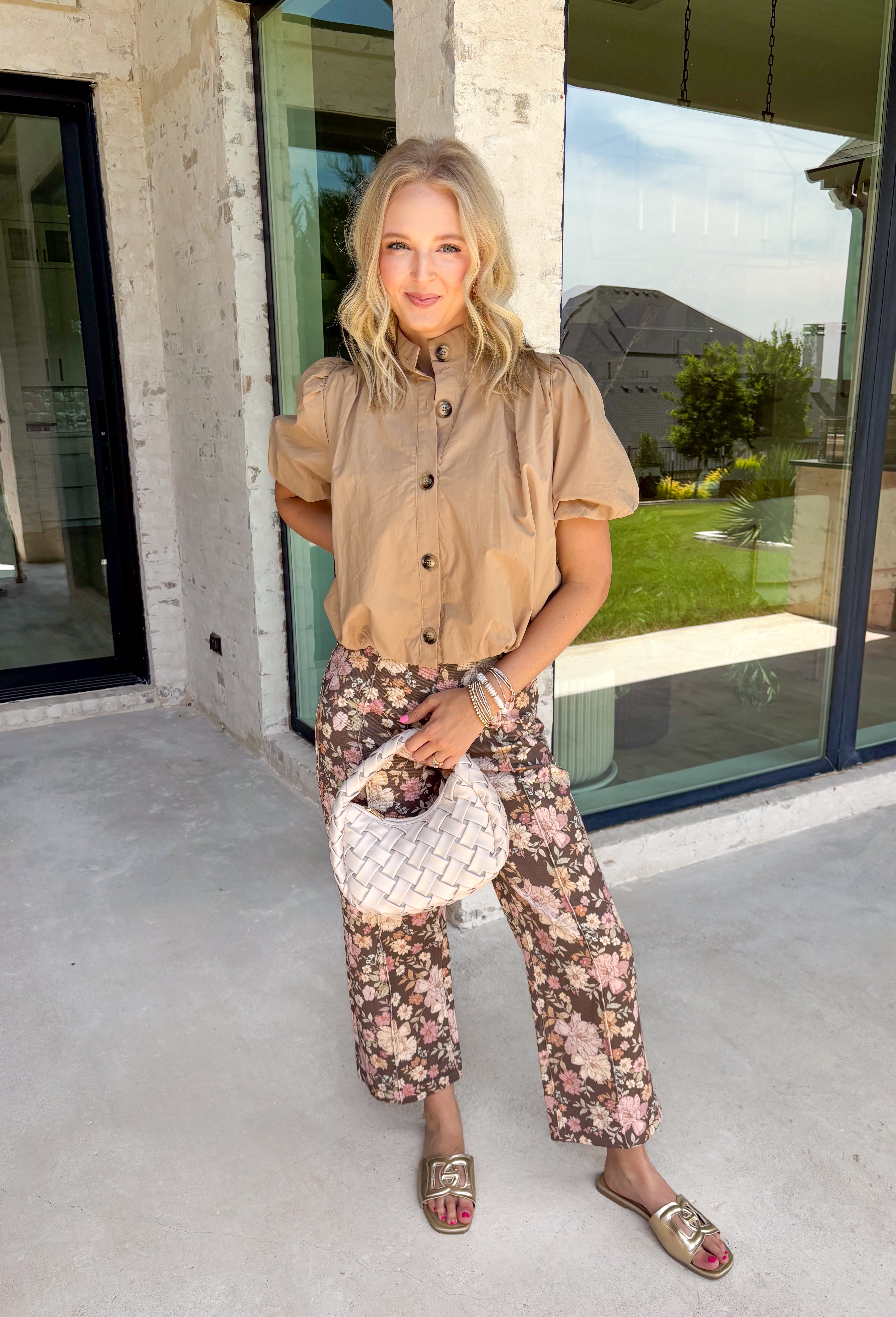 Simple, polished, and effortlessly chic, this tan button down top is a staple you'll wear all fall long. Crafted from breathable cotton, this timeless top features a modern bubble hem that creates a flattering silhouette with little effort. The band collar and button front add a tailored touch, while the short puff sleeves bring just the right amount of feminine charm. 