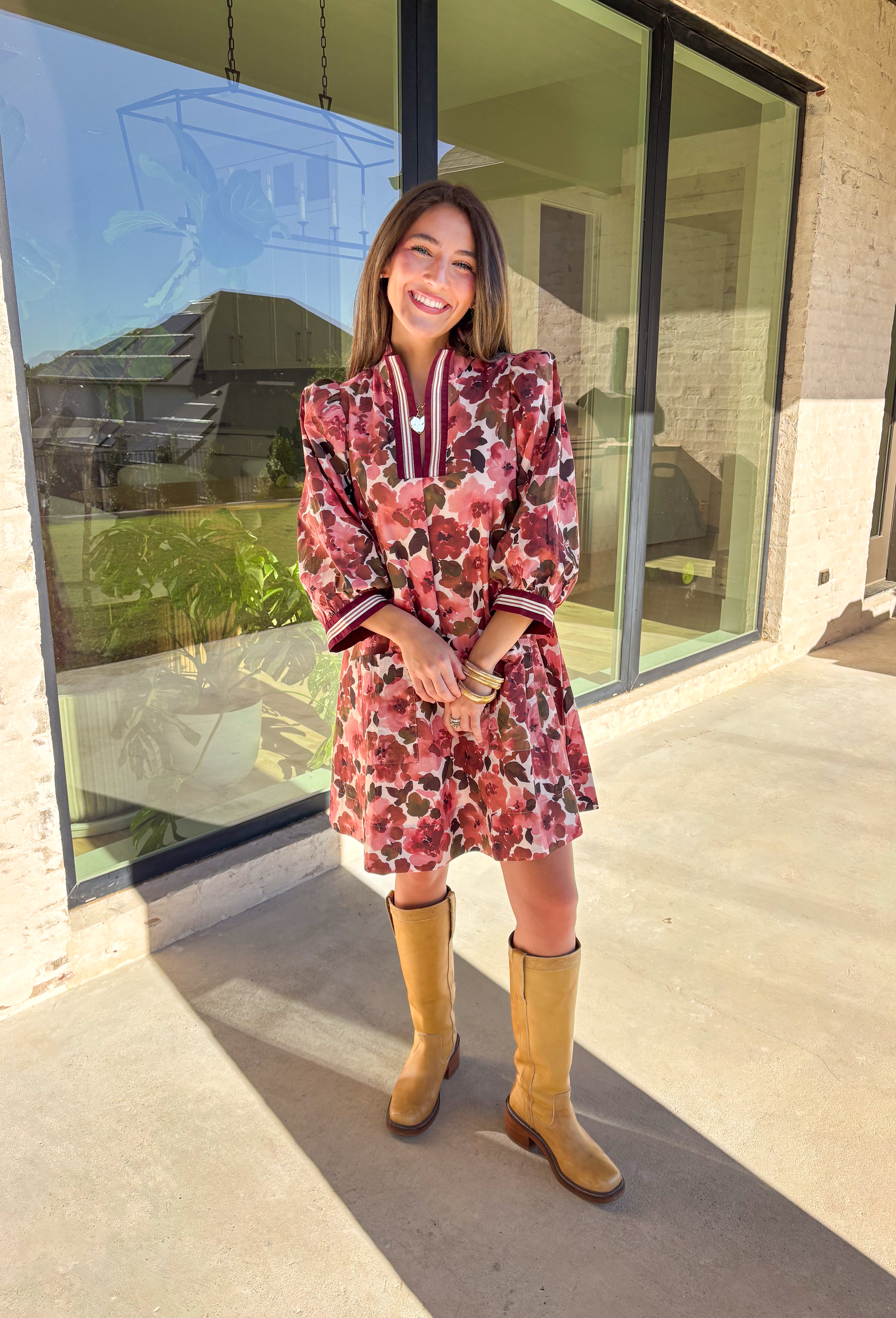 This floral dress by Entro is the perfect mix of playful and polished. Designed in rich shades of wine, it features puff sleeves and a striped trim collar and cuffs that add a sporty yet feminine touch. The patch pockets at the front bring in a bit of practicality, while the soft cotton fabric and full lining keep it comfortable and easy to wear. A fun fall piece that transitions seamlessly from weekday wear to weekend outings.