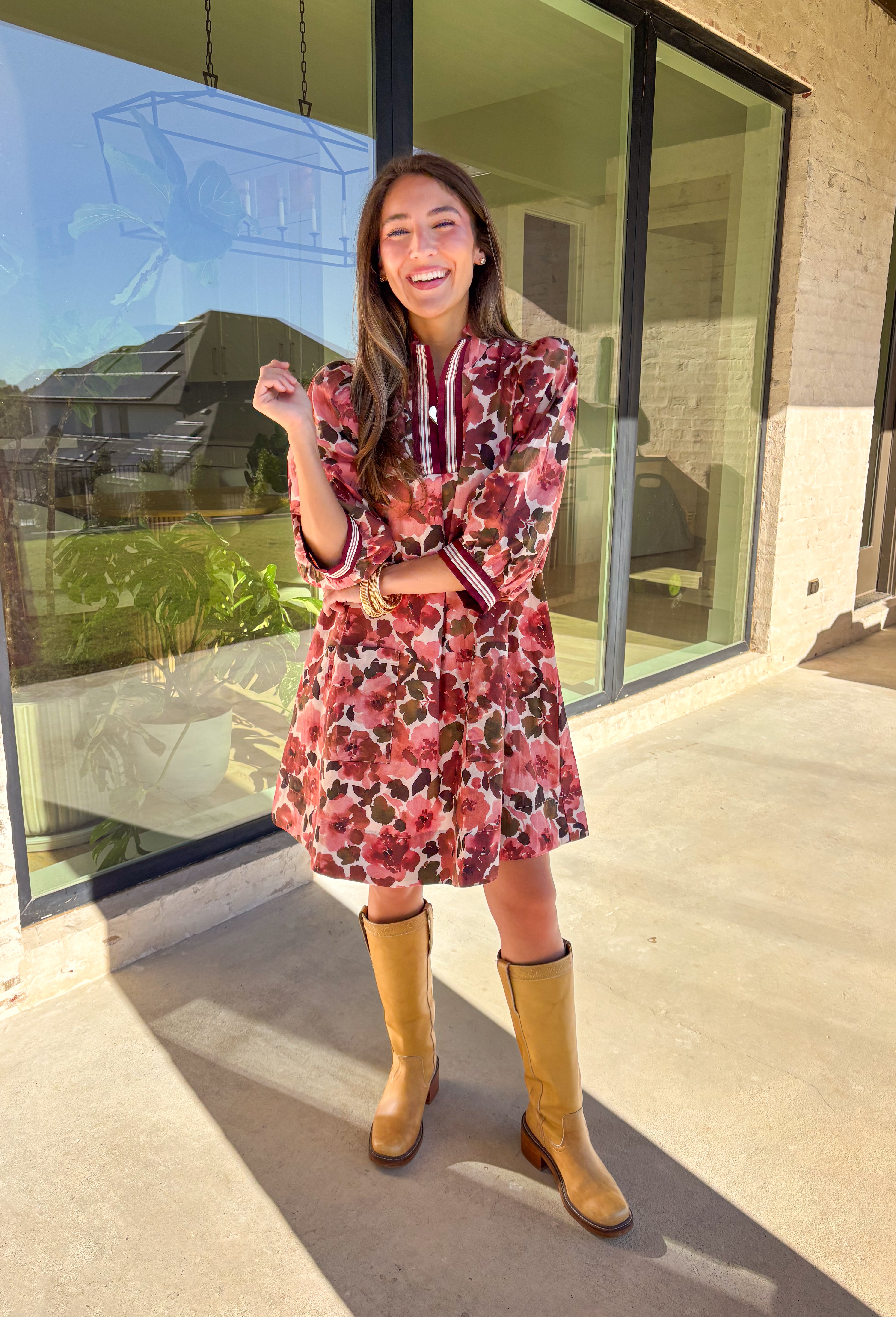 This floral dress by Entro is the perfect mix of playful and polished. Designed in rich shades of wine, it features puff sleeves and a striped trim collar and cuffs that add a sporty yet feminine touch. The patch pockets at the front bring in a bit of practicality, while the soft cotton fabric and full lining keep it comfortable and easy to wear. A fun fall piece that transitions seamlessly from weekday wear to weekend outings.