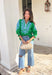 Simple with a special touch, this green ¾ sleeve top by Entro is an easy spring staple you’ll wear on repeat. Designed with a split v-neckline and contrast binding detail, it feels polished yet relaxed. Blue embroidered accents add just the right pop of color, giving the top a fresh, handcrafted feel. Finished with elasticated cuffs for comfort and shape, this piece pairs effortlessly with denim, trousers, or skirts for everyday spring style.