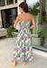 Romantic and effortlessly graceful, this cream strapless midi dress by Entro is made for special warm weather moments. Featuring a beautiful floral print with strawberries throughout, it’s designed with pleated detailing along the chest for a flattering shape and a smocked back for added comfort and flexibility. Side pockets add a practical touch, while the fully lined cotton fabric keeps it light and breathable. This will quickly become a favorite!
