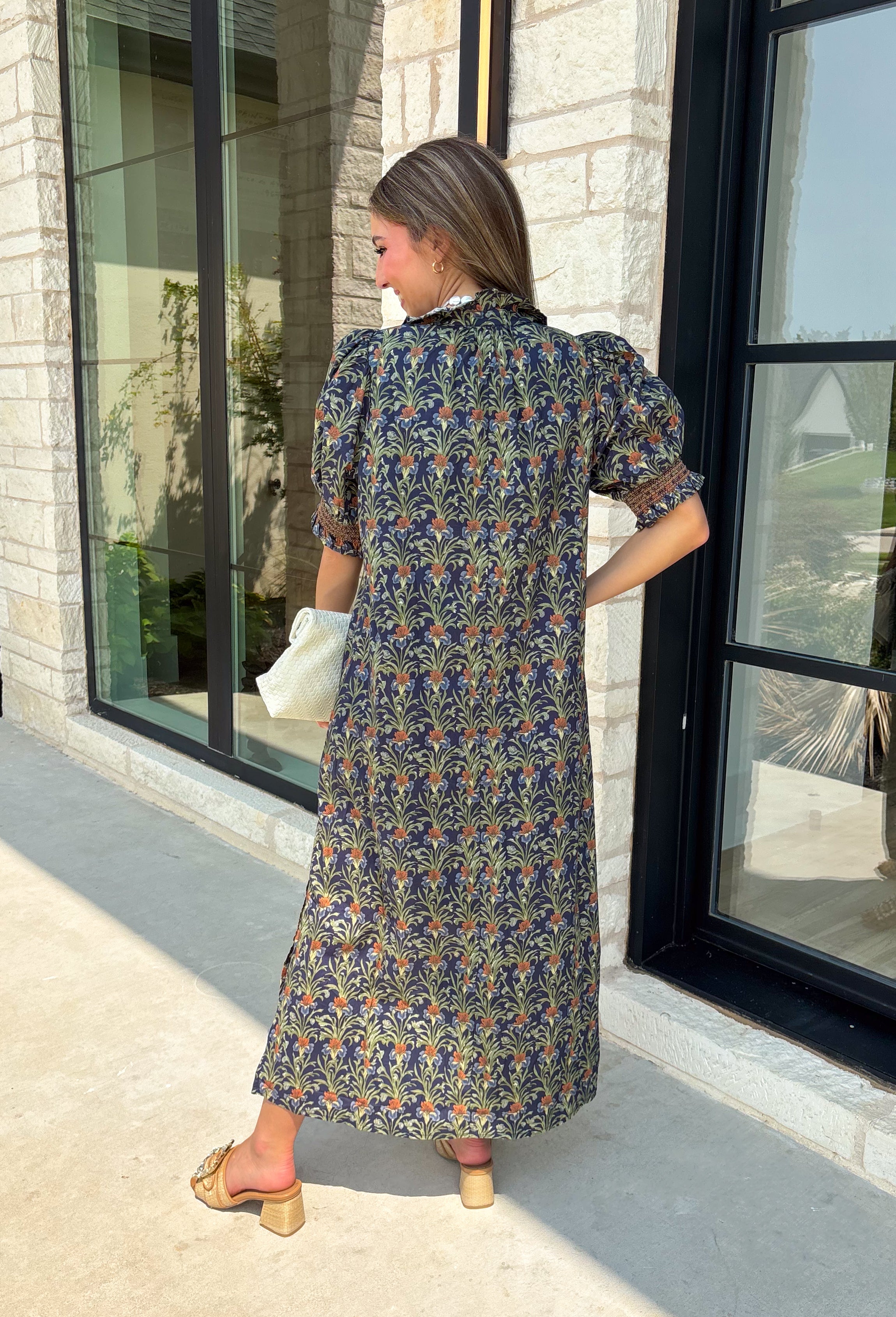 From weekend brunches to family gatherings, this floral midi dress is one you'll be reaching for all season long. Designed in a soft ecru hue with a beautiful floral print, this feminine silhouette is elevated with delicate eyelet lace embroidery throughout for an extra touch of texture and charm. The ruffle neckline, puff sleeves, and tiered ruffle hem create a timeless look, while side pockets make it as practical as it is pretty. 
