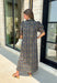 From weekend brunches to family gatherings, this floral midi dress is one you'll be reaching for all season long. Designed in a soft ecru hue with a beautiful floral print, this feminine silhouette is elevated with delicate eyelet lace embroidery throughout for an extra touch of texture and charm. The ruffle neckline, puff sleeves, and tiered ruffle hem create a timeless look, while side pockets make it as practical as it is pretty. 