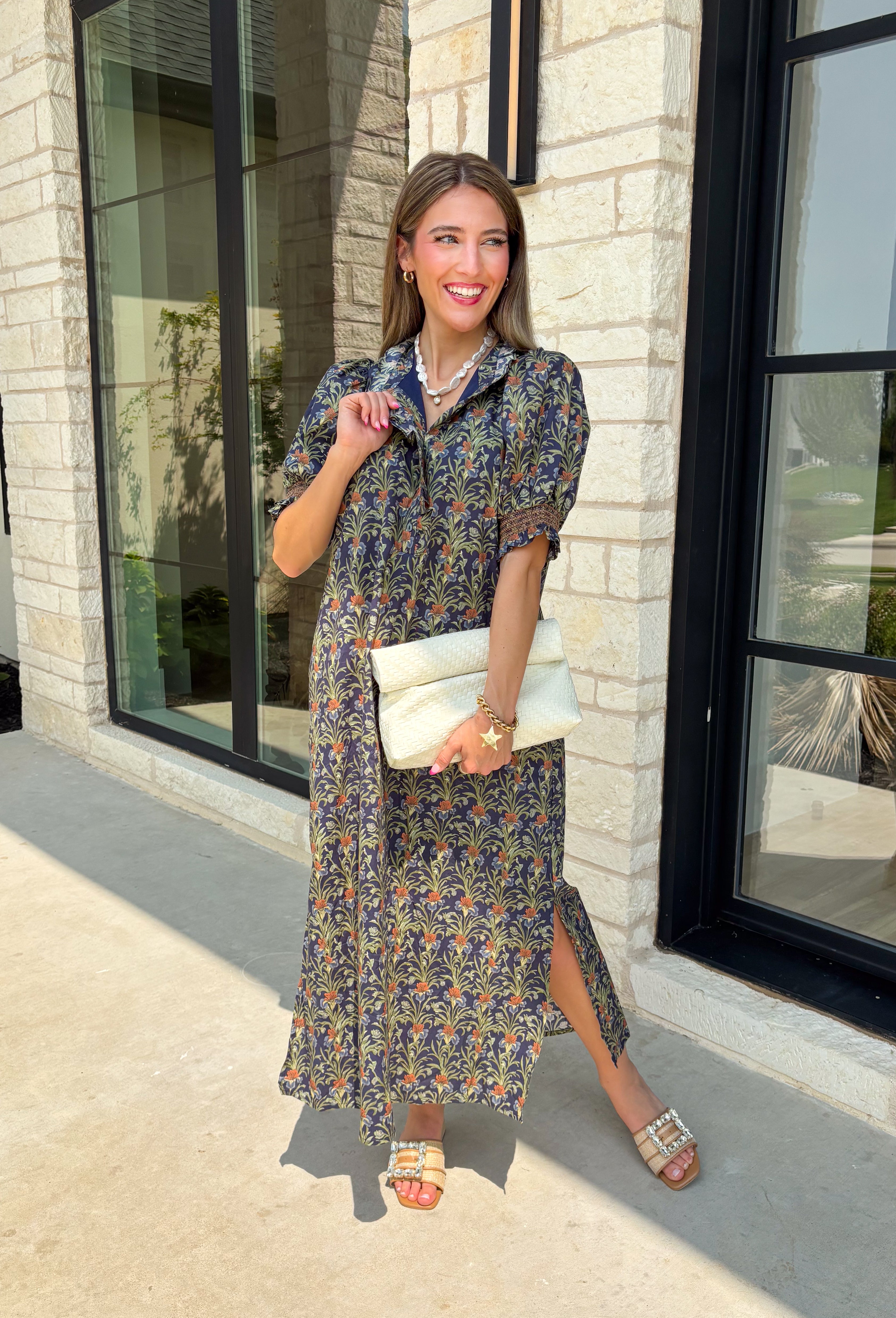 From weekend brunches to family gatherings, this floral midi dress is one you'll be reaching for all season long. Designed in a soft ecru hue with a beautiful floral print, this feminine silhouette is elevated with delicate eyelet lace embroidery throughout for an extra touch of texture and charm. The ruffle neckline, puff sleeves, and tiered ruffle hem create a timeless look, while side pockets make it as practical as it is pretty. 