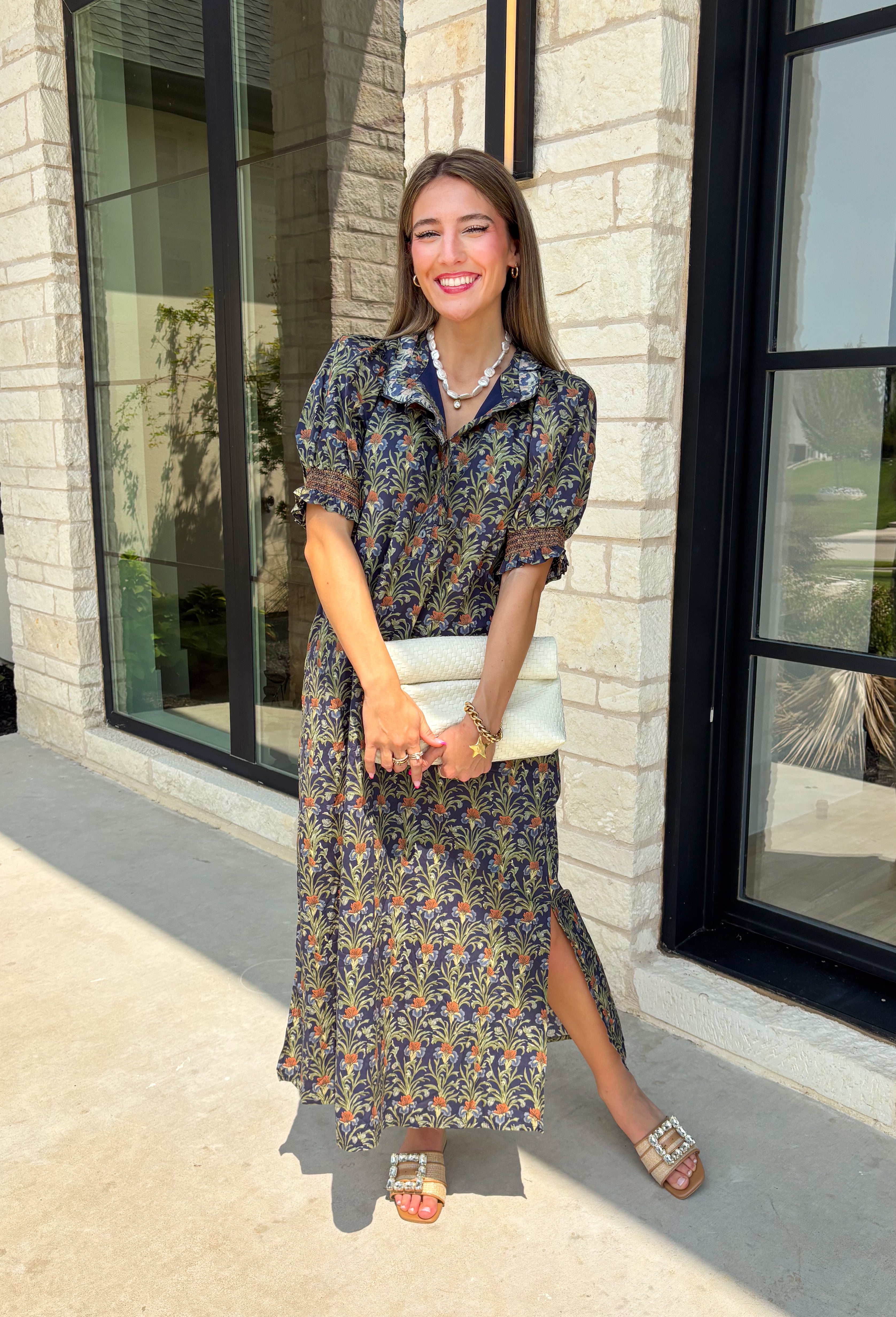 From weekend brunches to family gatherings, this floral midi dress is one you'll be reaching for all season long. Designed in a soft ecru hue with a beautiful floral print, this feminine silhouette is elevated with delicate eyelet lace embroidery throughout for an extra touch of texture and charm. The ruffle neckline, puff sleeves, and tiered ruffle hem create a timeless look, while side pockets make it as practical as it is pretty. 