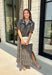From weekend brunches to family gatherings, this floral midi dress is one you'll be reaching for all season long. Designed in a soft ecru hue with a beautiful floral print, this feminine silhouette is elevated with delicate eyelet lace embroidery throughout for an extra touch of texture and charm. The ruffle neckline, puff sleeves, and tiered ruffle hem create a timeless look, while side pockets make it as practical as it is pretty. 